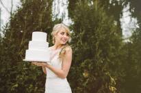 bride and cake with trees background